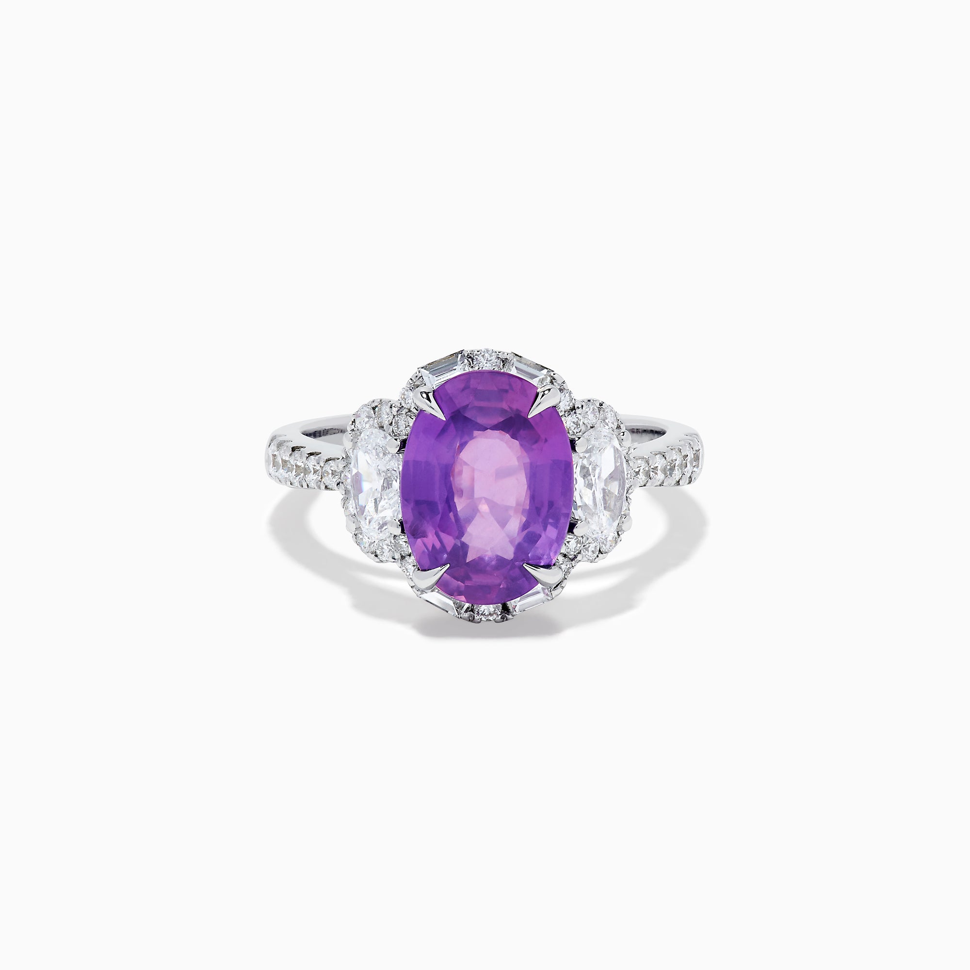 The Effy Hematian 18K White Gold Oval Purple Sapphire and Diamond Halo Ring features a central oval purple sapphire, two oval white diamonds, and smaller diamonds along the band, displayed on a white background.