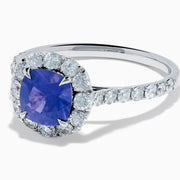 The Effy Hematian 18K White Gold Purple Sapphire and Diamond Halo Ring features a stunning round purple sapphire at the center, surrounded by sparkling diamonds with additional diamond accents along the band.