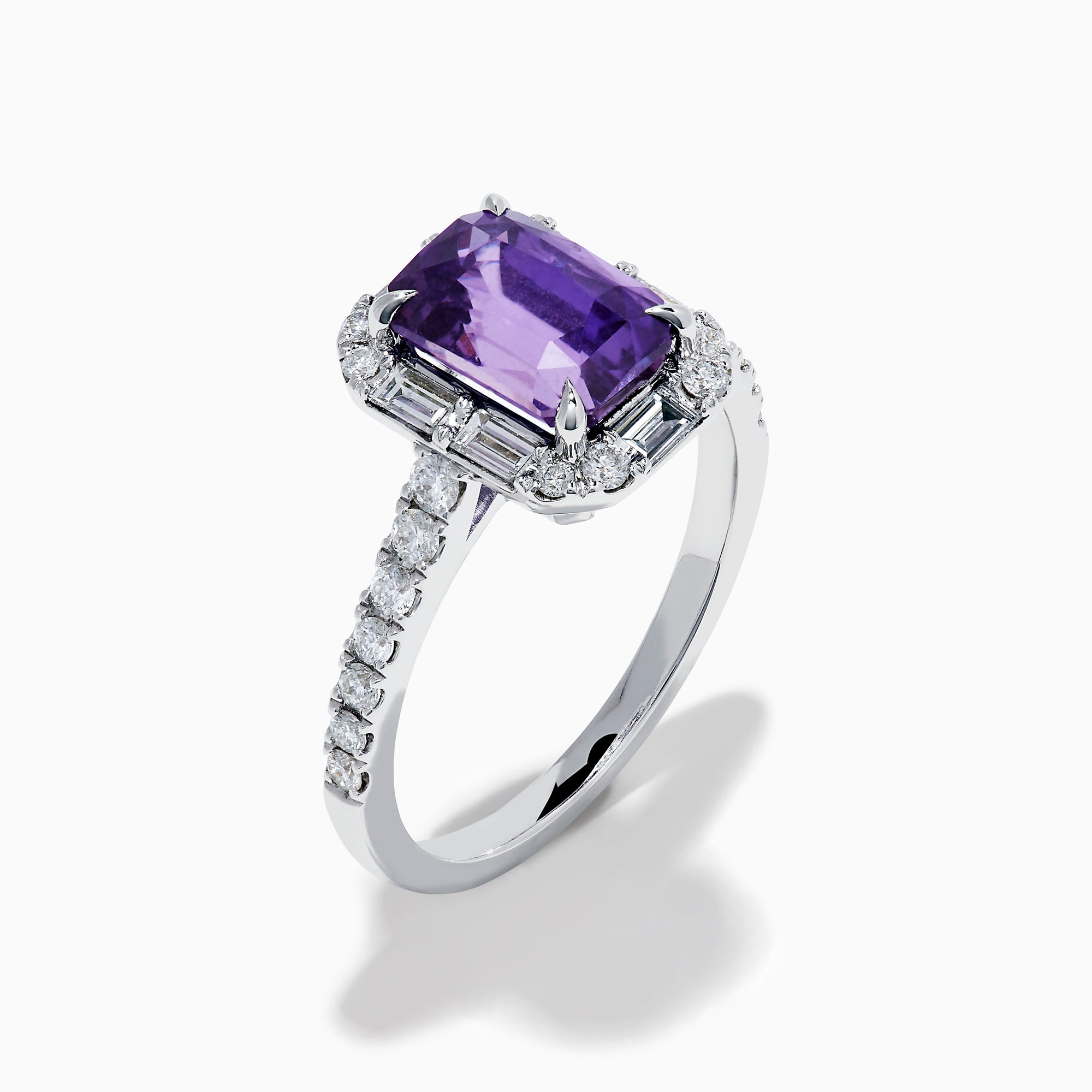 The Effy Hematian 18K White Gold Octagon Purple Sapphire and Diamond Halo Ring features a striking octagonal purple sapphire centerpiece, encircled by sparkling diamond halos on the band and around the main stone.
