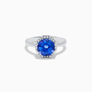 The Nahla Siri 14K Gold Octagon Cut Tanzanite and Diamond Ring showcases a large octagon-cut tanzanite at the center, bordered by sparkling diamonds, shown against a white background.