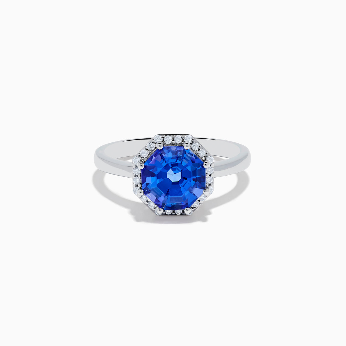 The Nahla Siri 14K Gold Octagon Cut Tanzanite and Diamond Ring showcases a large octagon-cut tanzanite at the center, bordered by sparkling diamonds, shown against a white background.