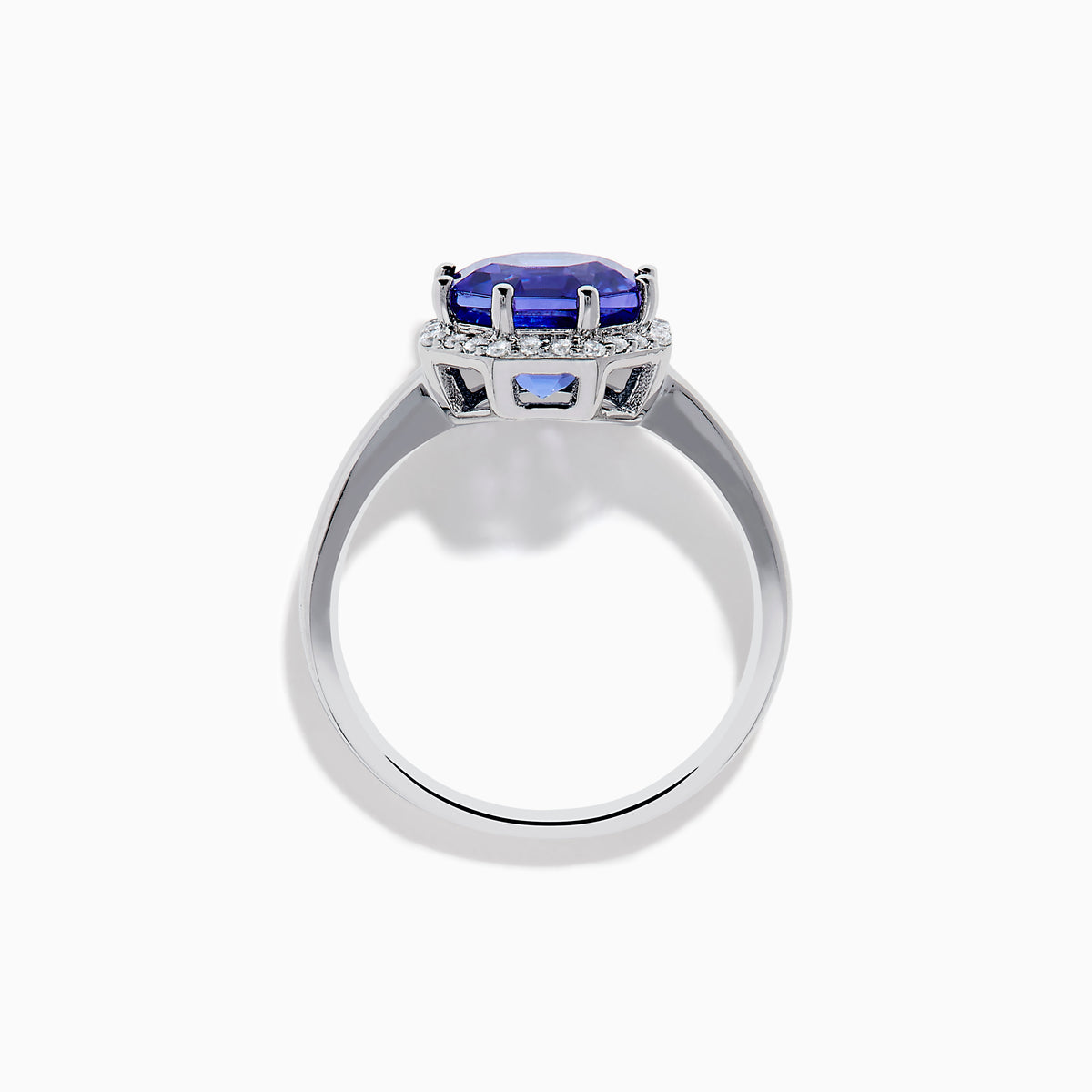 The Nahla Siri 14K Gold Octagon Cut Tanzanite and Diamond Ring showcases a large octagon-cut tanzanite at the center, bordered by sparkling diamonds, shown against a white background.