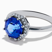 The Nahla Siri 14K Gold Octagon Cut Tanzanite and Diamond Ring showcases a large octagon-cut tanzanite at the center, bordered by sparkling diamonds, shown against a white background.