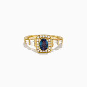 The 18K Yellow Gold GIA Certified Alexandrite and Diamond Halo Ring features a rectangular, iridescent center stone with a diamond halo and diamonds on the band, shown against a white background.