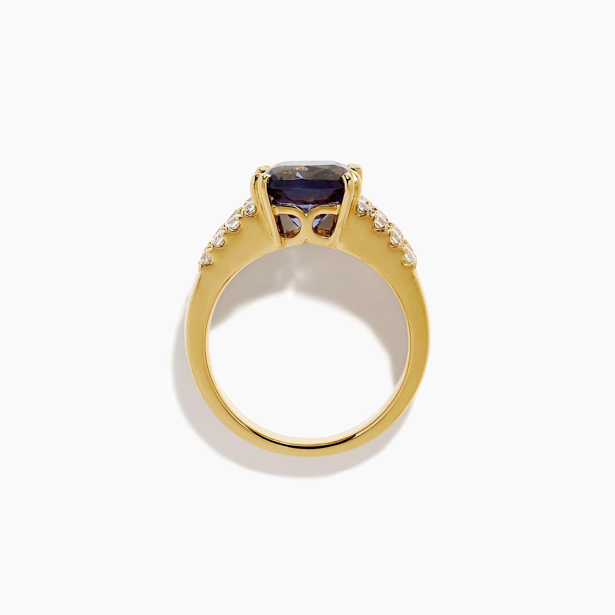 The 18K Yellow Gold GIA Certified Zoisite and Diamond Ring showcases a large square-cut zoisite center stone with rows of round and rectangular diamonds on each side, all set in elegant yellow gold.