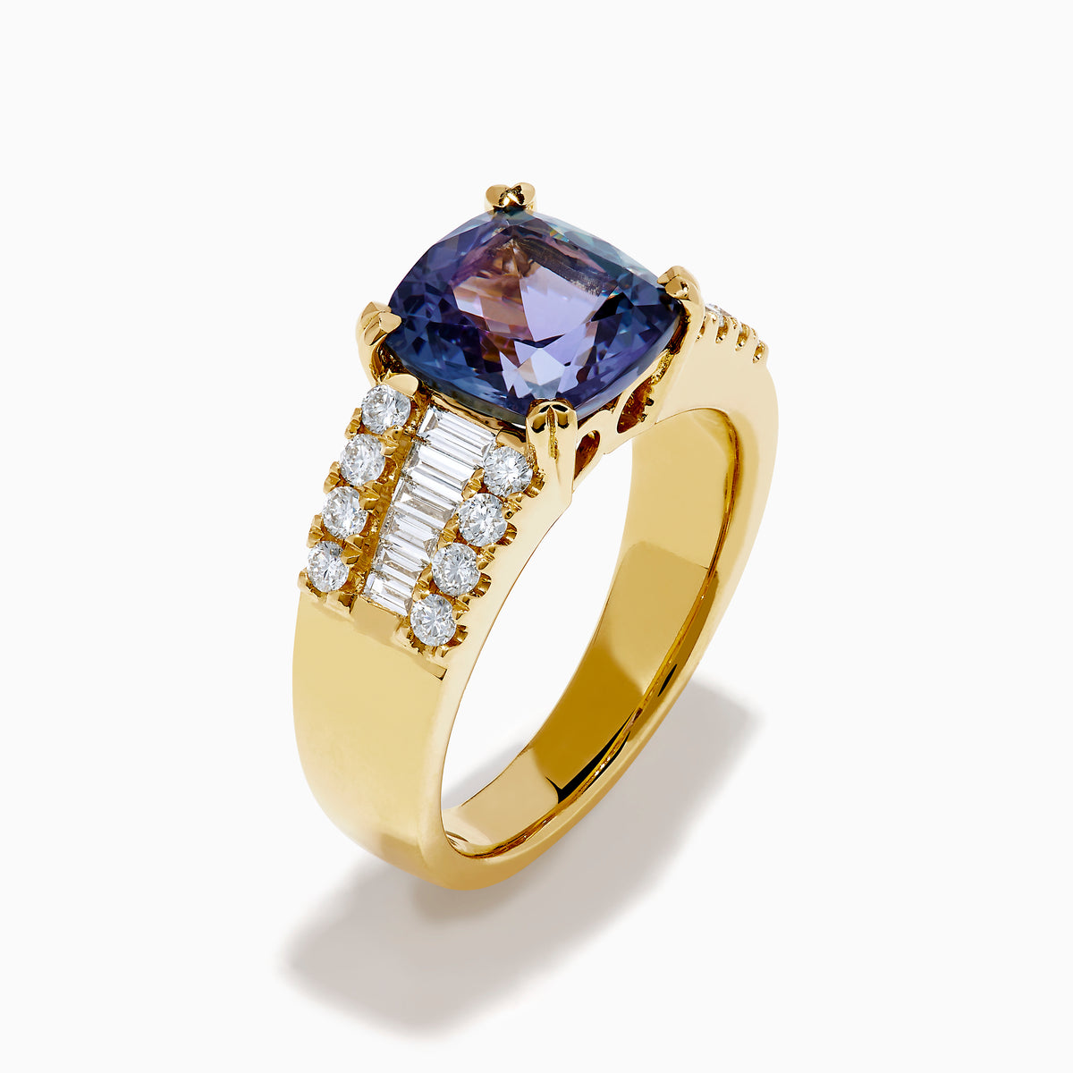 The 18K Yellow Gold GIA Certified Zoisite and Diamond Ring showcases a large square-cut zoisite center stone with rows of round and rectangular diamonds on each side, all set in elegant yellow gold.