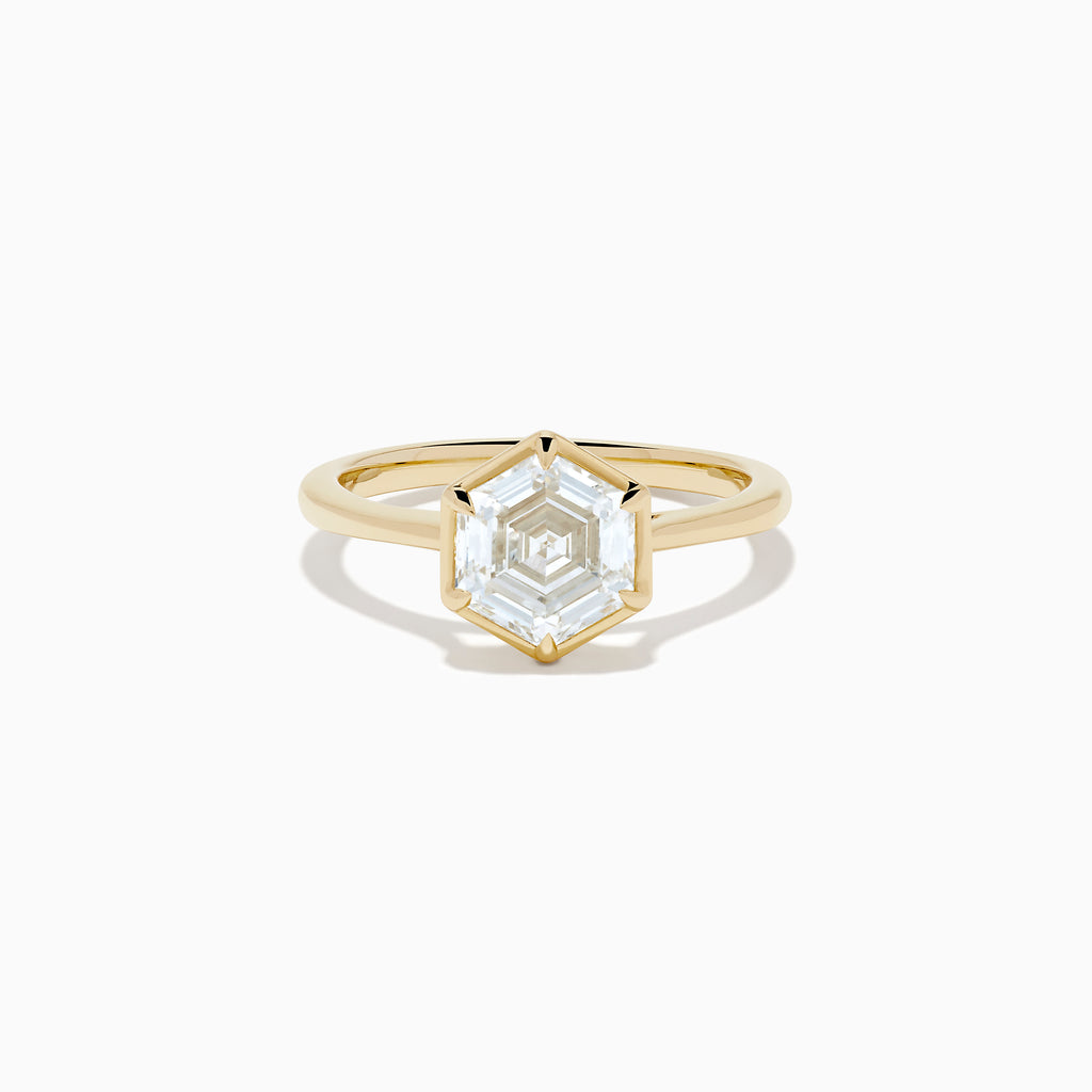 The Lab Grown Diamond 2.00ct Hexagon Solitaire Ring in 14K Yellow Gold showcases a hexagon-shaped, lab grown diamond with a geometric stepped cut, set on a sleek, polished gold band and displayed against a white background.