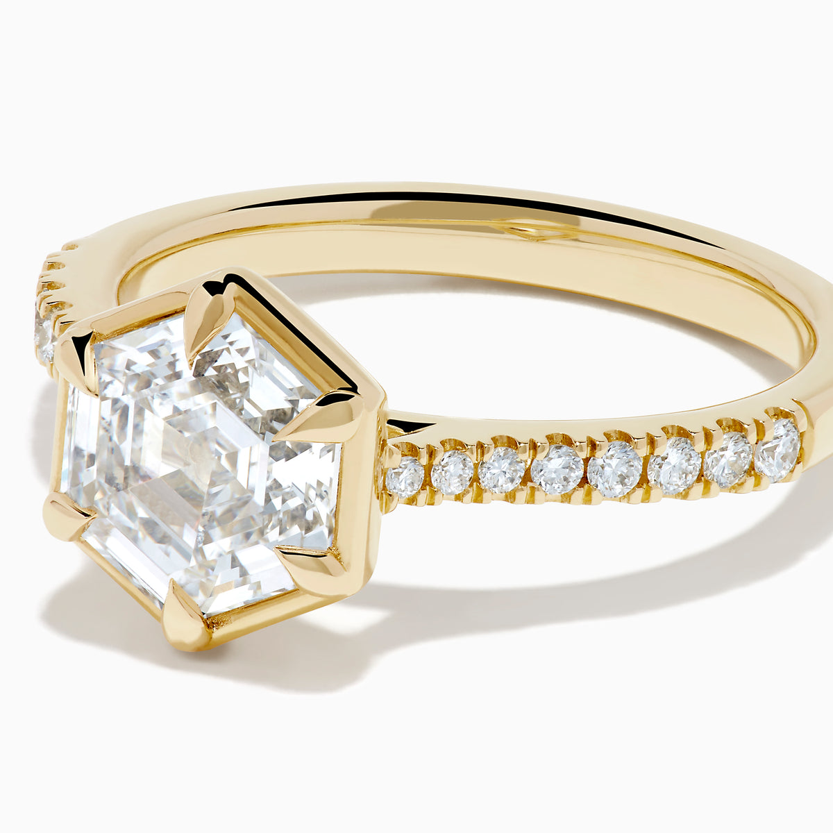 Presenting the Lab Grown Diamond 2.00ct Hexagon with Pave Band Ring in 14K Yellow Gold: a striking ring with a hexagonal-cut lab grown diamond at its center, accented by sparkling pave-set diamonds along the polished 14K yellow gold band, showcased on a clean white background.