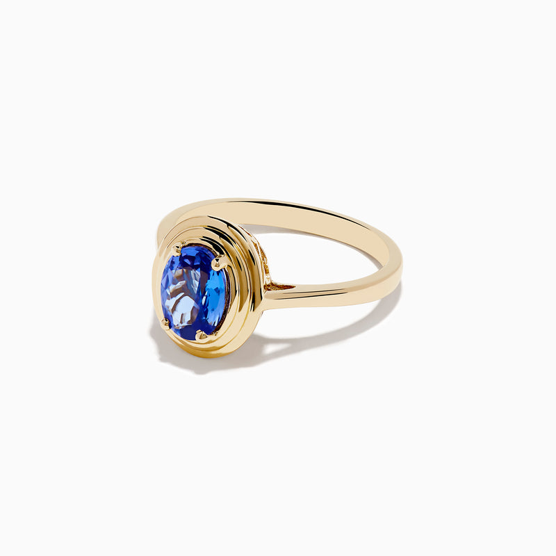 The 14K Yellow Gold Tanzanite Faux-Triple Bezel Ring features an oval tanzanite gemstone in a smooth, polished bezel setting, shown from the front against a white background.