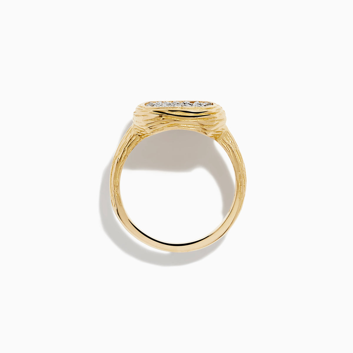 The D'Oro 14K Two Tone Gold Diamond Signet Ring features a textured band and a square-shaped cluster of sparkling diamonds at the center, giving a modern twist to the classic signet ring style.