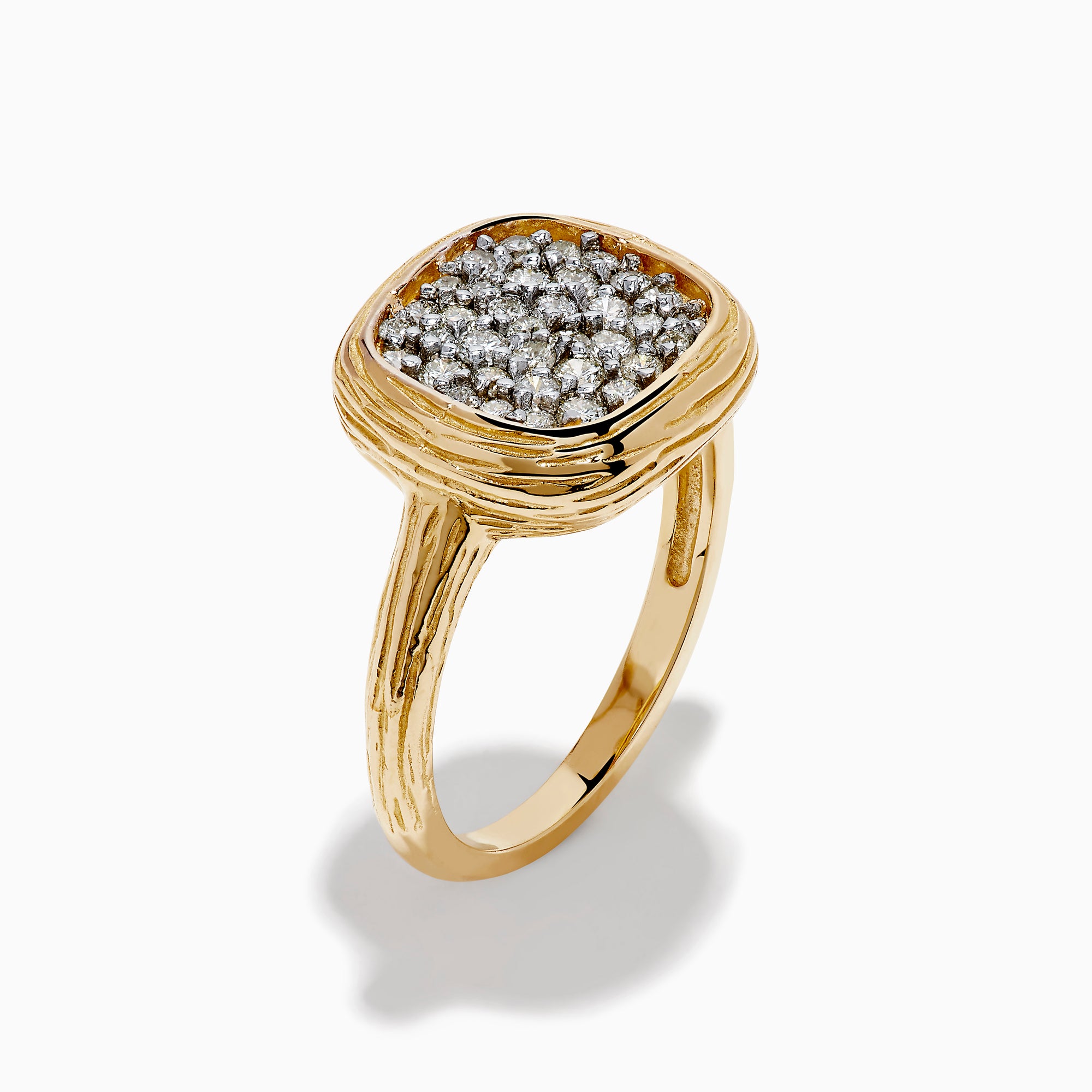 The D'Oro 14K Two Tone Gold Diamond Signet Ring features a textured band and a square-shaped cluster of sparkling diamonds at the center, giving a modern twist to the classic signet ring style.