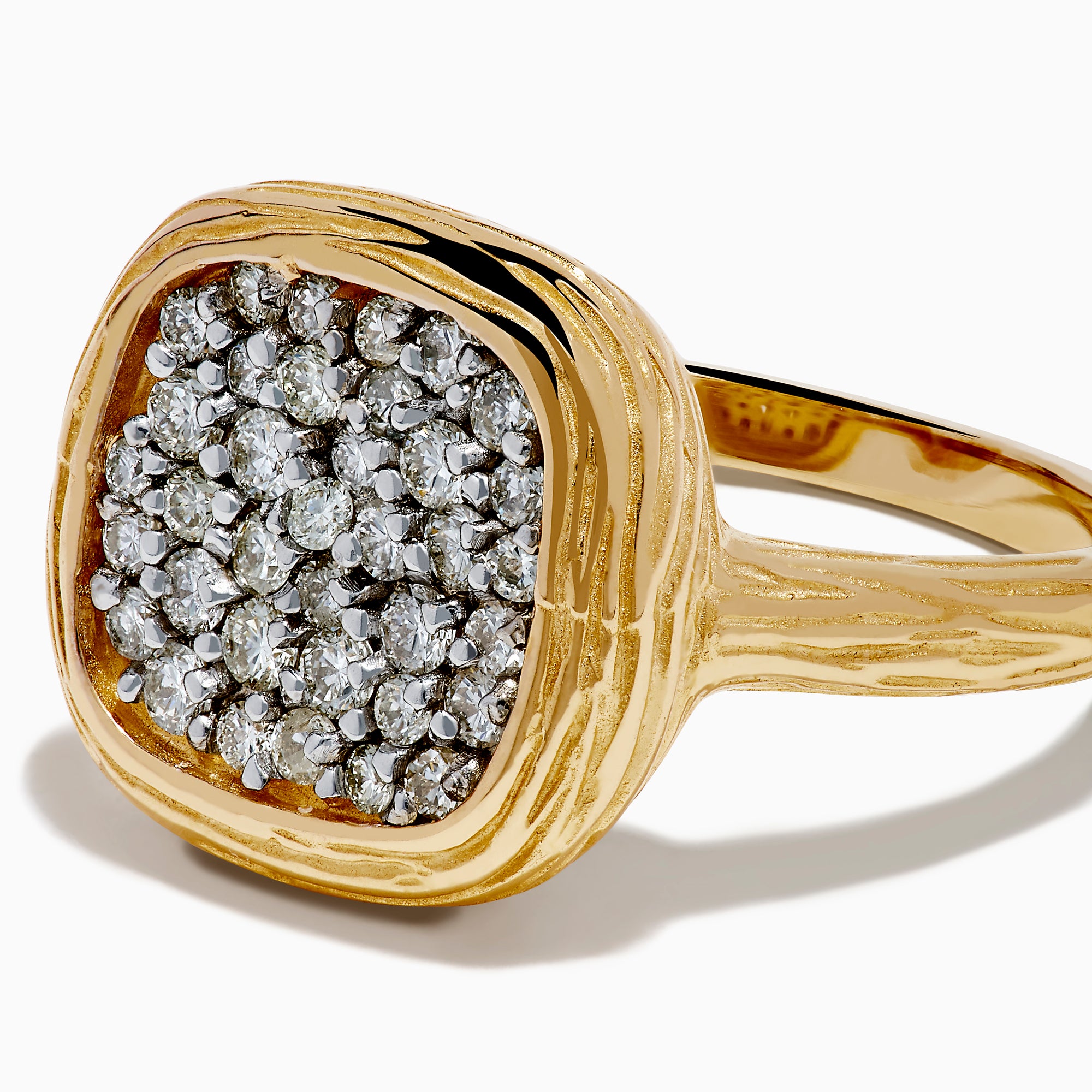 The D'Oro 14K Two Tone Gold Diamond Signet Ring features a textured band and a square-shaped cluster of sparkling diamonds at the center, giving a modern twist to the classic signet ring style.