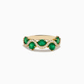 The 14K Yellow Gold Emerald and Diamond Ring features five round emeralds, each surrounded by sparkling white diamonds in a scalloped design, set on a smooth, polished gold band.