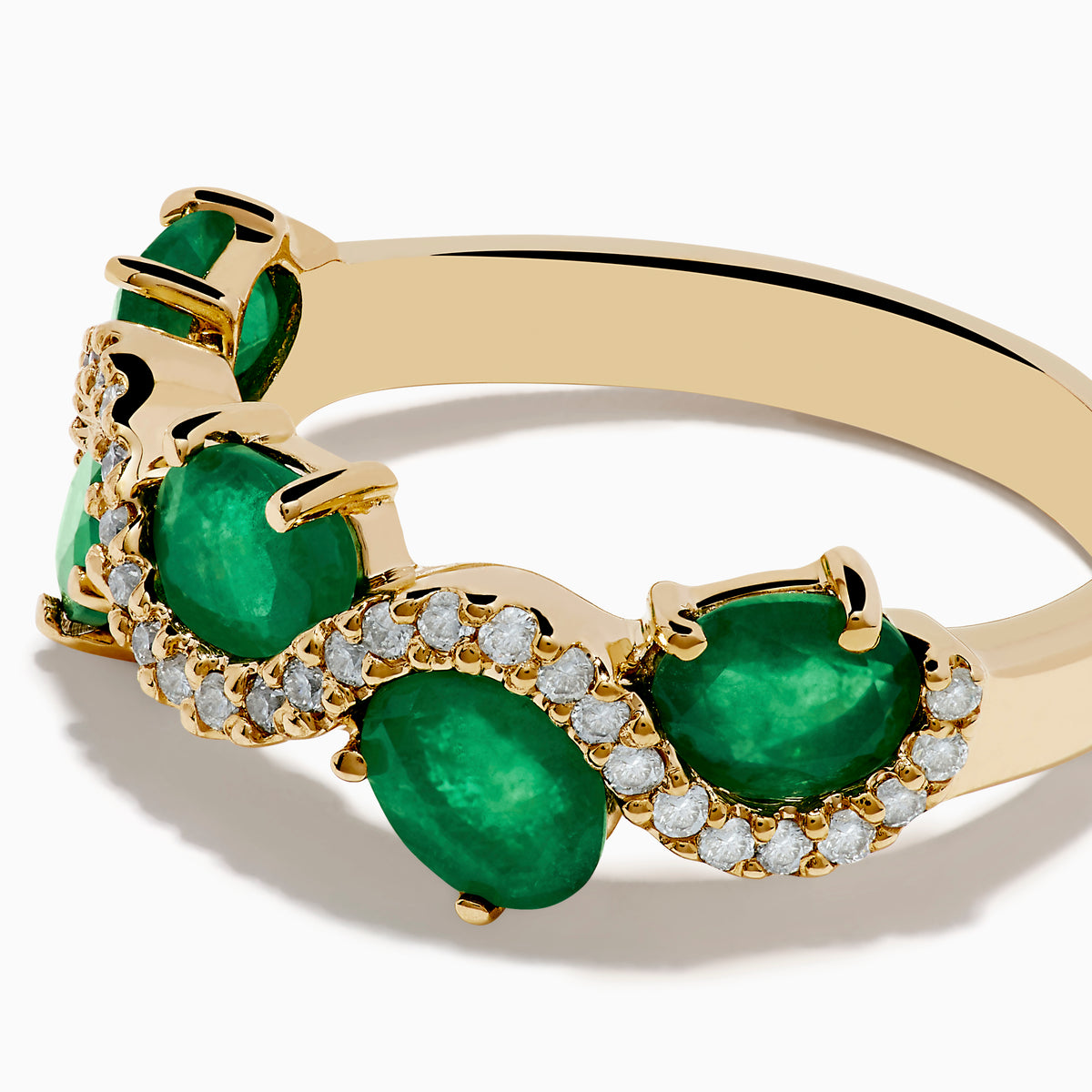 The 14K Yellow Gold Emerald and Diamond Ring features five round emeralds, each surrounded by sparkling white diamonds in a scalloped design, set on a smooth, polished gold band.