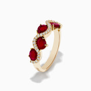 The 14K Yellow Gold Ruby and Diamond Ring showcases four oval rubies in a wavy design, accented with small white diamonds along the curves.