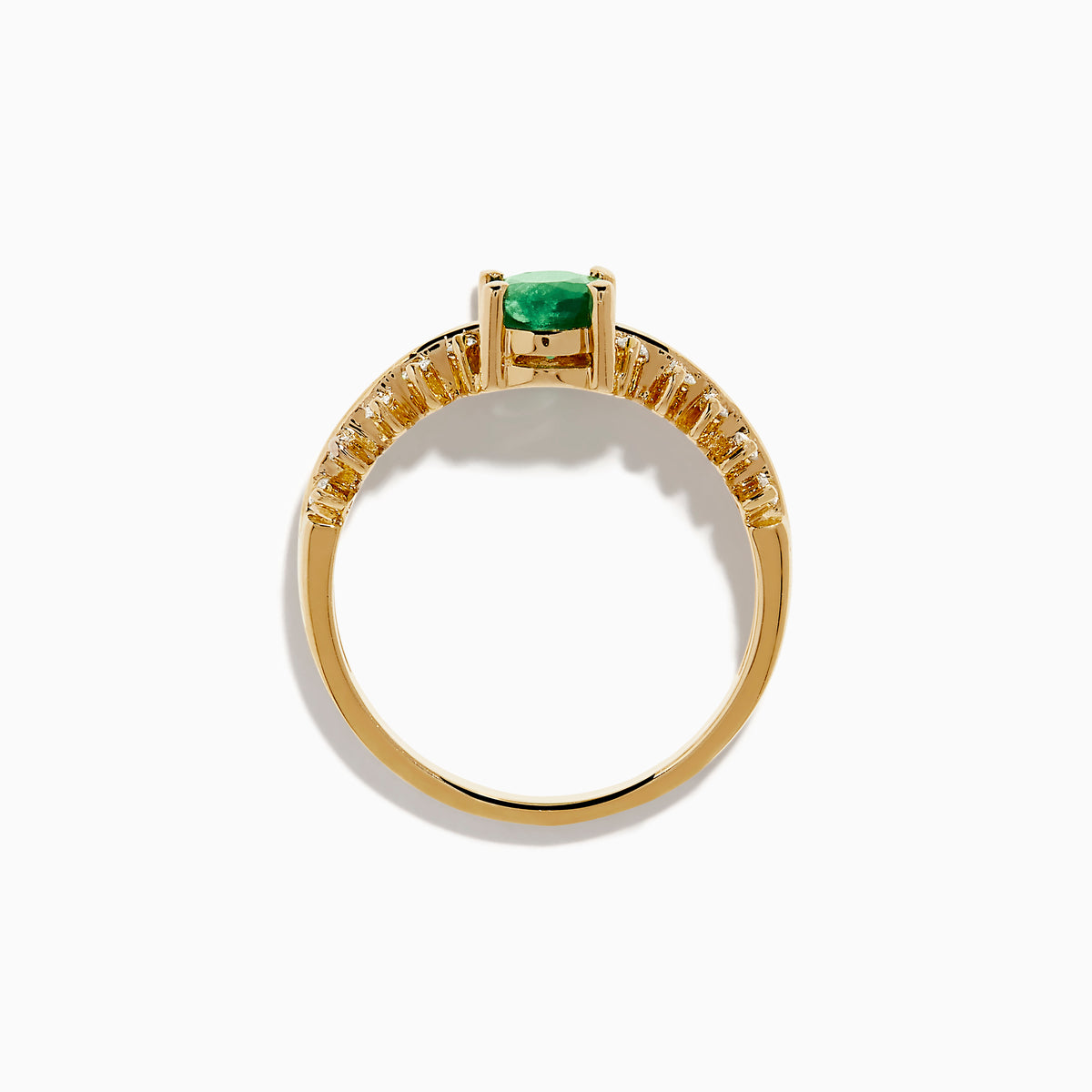 The 14K Yellow Gold Emerald and Diamond Ring showcases an oval green emerald center, framed by two rows of round diamonds on each side, set in yellow gold against a white background.