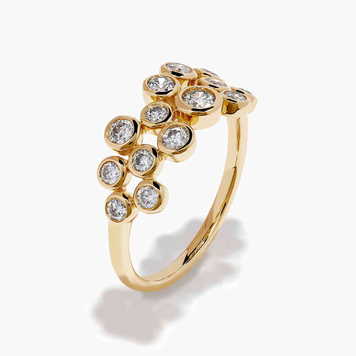 The D'Oro 14K Yellow Gold Bezel Set Diamond Band features two staggered rows of bezel-set round white diamonds in an open, airy design, shown against a white background.