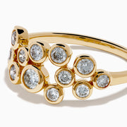 The D'Oro 14K Yellow Gold Bezel Set Diamond Band features two staggered rows of bezel-set round white diamonds in an open, airy design, shown against a white background.