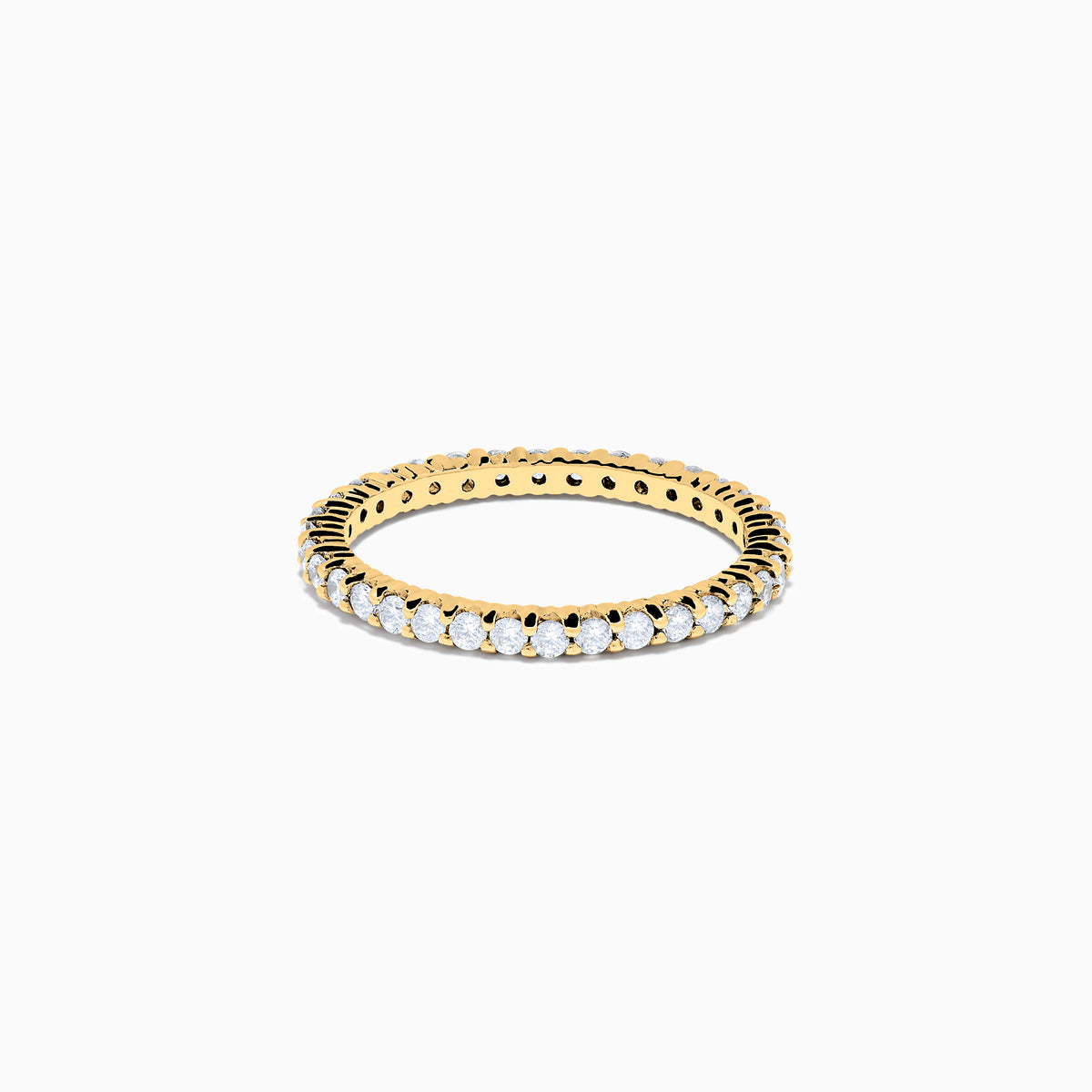 The 14K Yellow Gold Prong Set Diamond Eternity Band, 0.50 TCW, features a continuous row of oval-cut diamonds and is photographed on a plain white background.