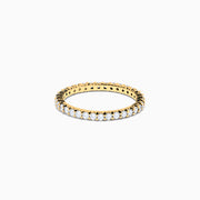 The 14K Yellow Gold Prong Set Diamond Eternity Band, 0.50 TCW, features a continuous row of oval-cut diamonds and is photographed on a plain white background.