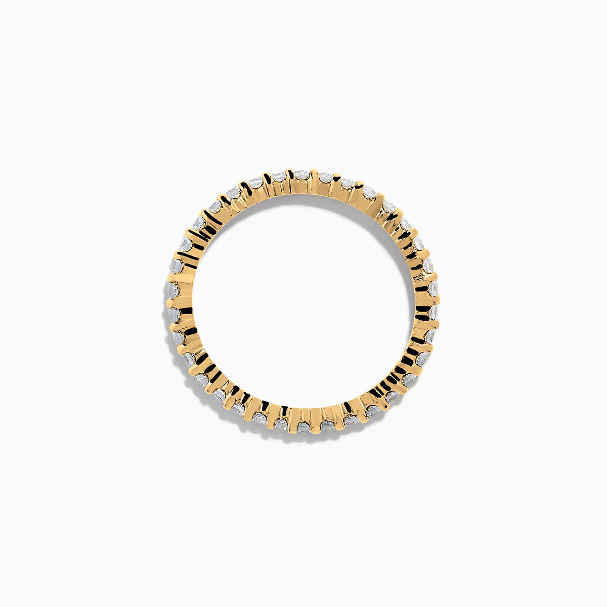 The 14K Yellow Gold Prong Set Diamond Eternity Band, 0.50 TCW, features a continuous row of oval-cut diamonds and is photographed on a plain white background.
