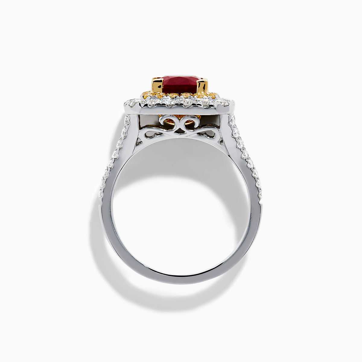 The 18K 2-Tone Gold Ruby, Yellow and White Diamond Double Halo Ring features a square ruby center, surrounded by yellow and white diamonds, set on a silver band with diamond accents.
