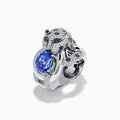 The Signature 14K White Gold Tanzanite and Diamond Panther Ring features diamond accents, green gemstone eyes, and a large oval tanzanite held in the panther's paws and mouth.