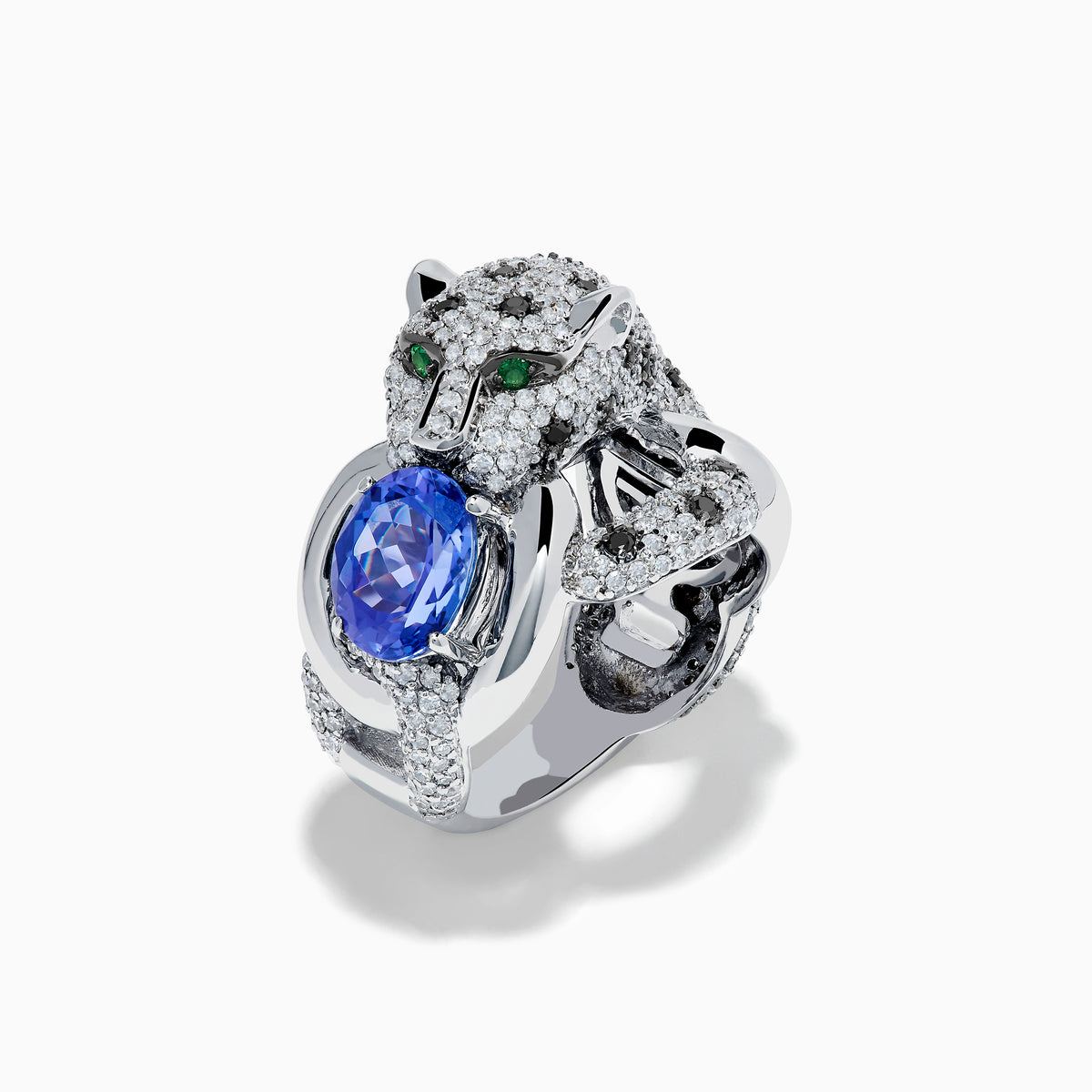 The Signature 14K White Gold Tanzanite and Diamond Panther Ring features diamond accents, green gemstone eyes, and a large oval tanzanite held in the panther's paws and mouth.
