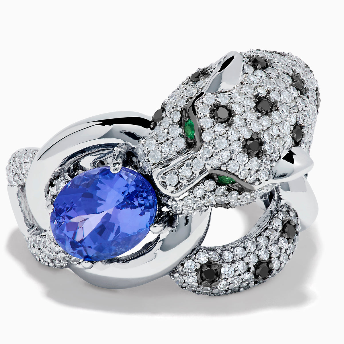 The Signature 14K White Gold Tanzanite and Diamond Panther Ring features diamond accents, green gemstone eyes, and a large oval tanzanite held in the panther's paws and mouth.