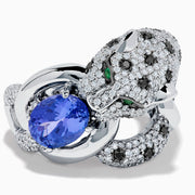 The Signature 14K White Gold Tanzanite and Diamond Panther Ring features diamond accents, green gemstone eyes, and a large oval tanzanite held in the panther's paws and mouth.