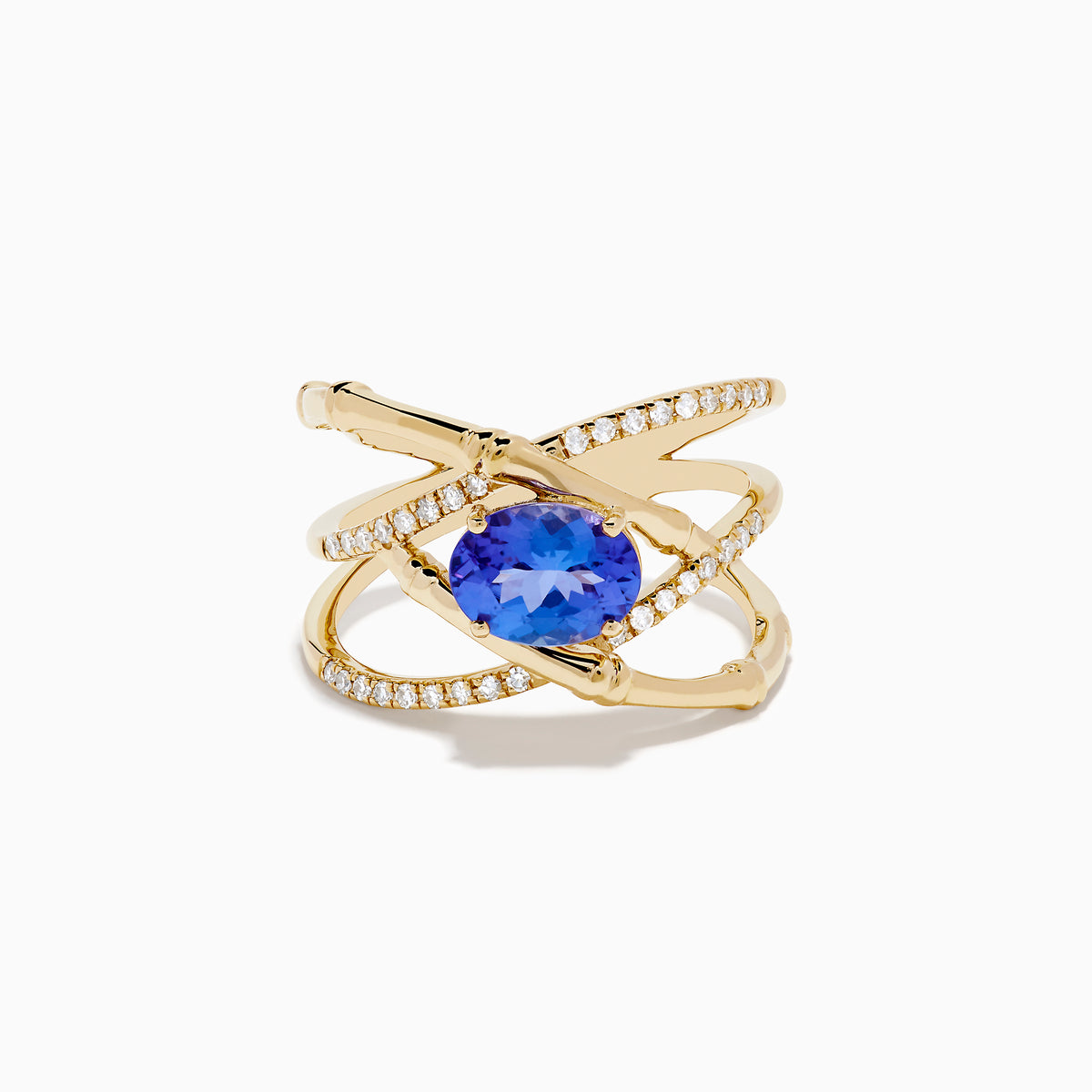 The Nahla 14K Yellow Gold Tanzanite and Diamond Criss Cross Ring features an oval tanzanite centerpiece and sparkling diamond crisscross bands, all set against a white background.