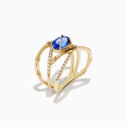 The Nahla 14K Yellow Gold Tanzanite and Diamond Criss Cross Ring features an oval tanzanite centerpiece and sparkling diamond crisscross bands, all set against a white background.