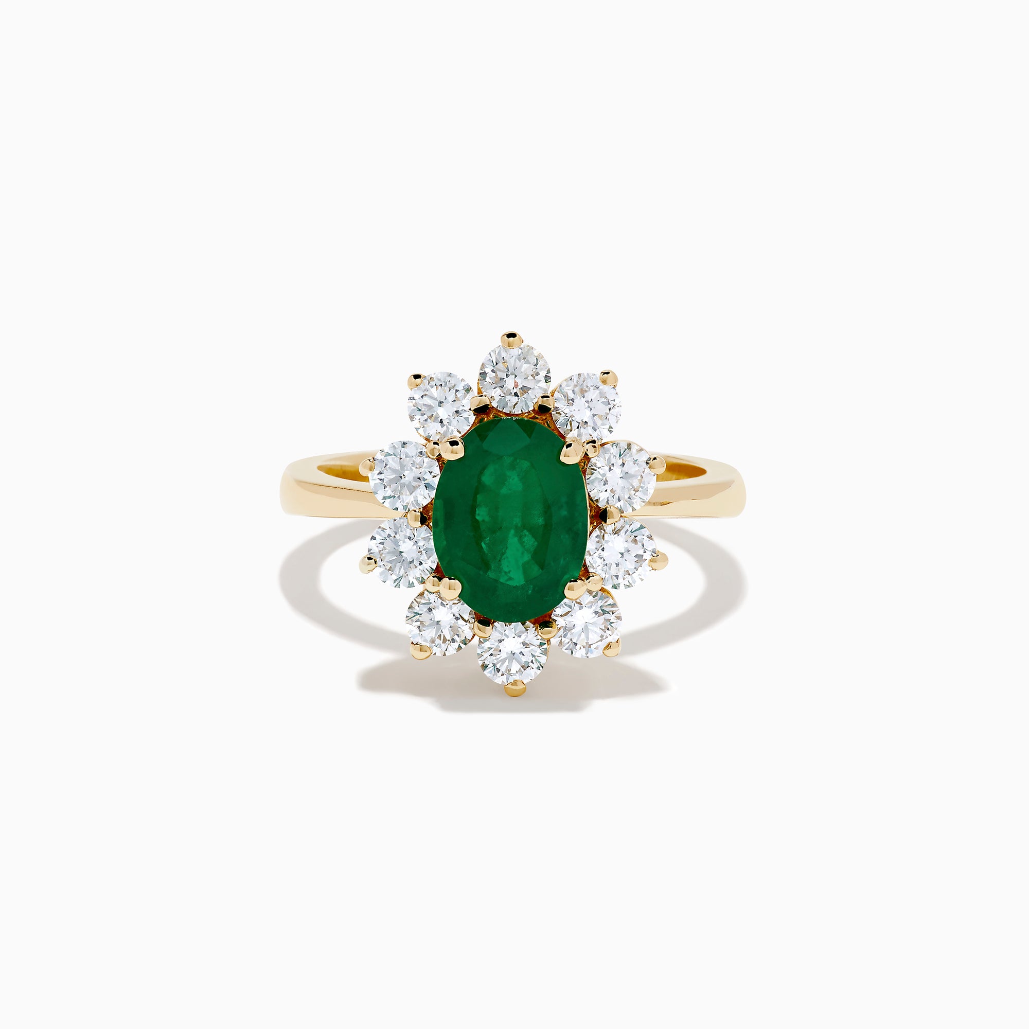 The 14K Yellow Gold Natural Emerald and Diamond Lady Di Ring showcases an oval emerald center surrounded by a halo of round white diamonds.