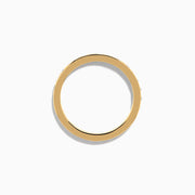 The 14K Yellow Gold Channel Set Diamond Eternity Band, 0.50 TCW, features small round white diamonds encircling the band and is shown on a white background.