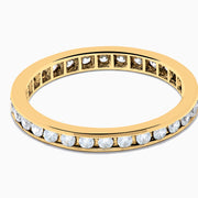 The 14K Yellow Gold Channel Set Diamond Eternity Band, 0.50 TCW, features small round white diamonds encircling the band and is shown on a white background.