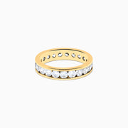 The 14K Yellow Gold Channel Set Diamond Eternity Band, 2.00 TCW, features round white diamonds encircling the band and is beautifully showcased against a plain white background.
