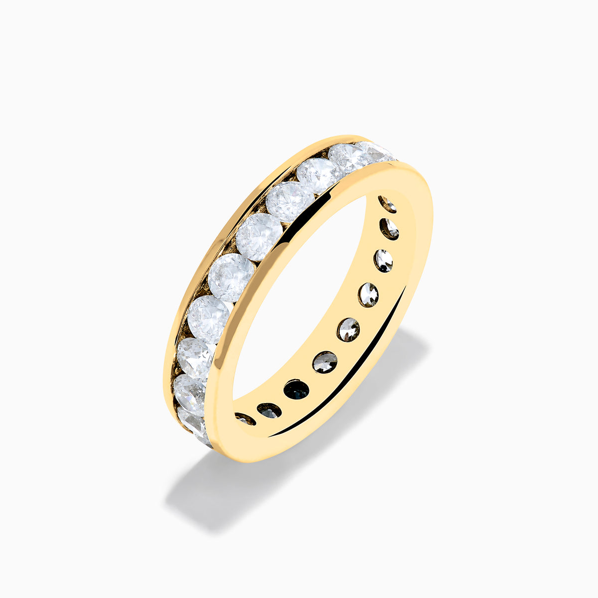 The 14K Yellow Gold Channel Set Diamond Eternity Band, 2.00 TCW, features round white diamonds encircling the band and is beautifully showcased against a plain white background.