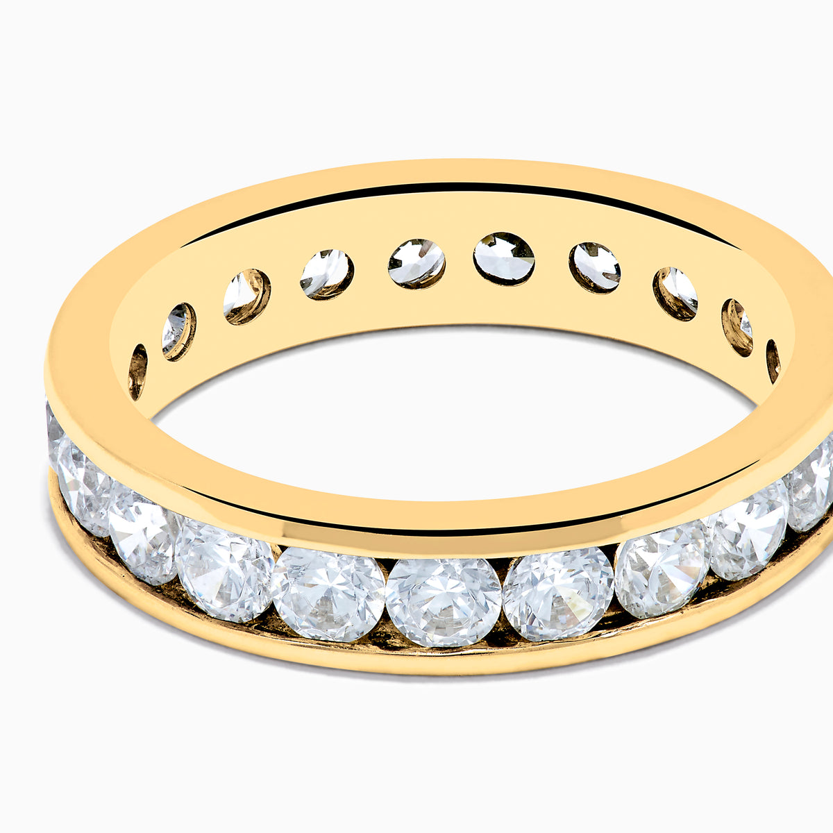 The 14K Yellow Gold Channel Set Diamond Eternity Band, 2.00 TCW, features round white diamonds encircling the band and is beautifully showcased against a plain white background.