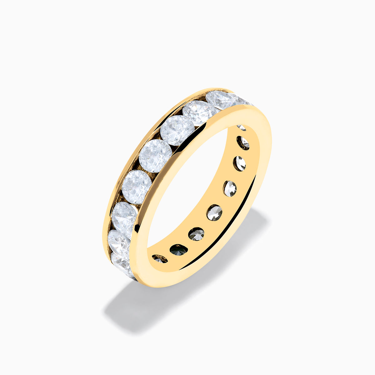 The 14K Yellow Gold Channel Set Diamond Eternity Band, 3.00 TCW, features round diamonds encircling the band and is displayed on a white background.