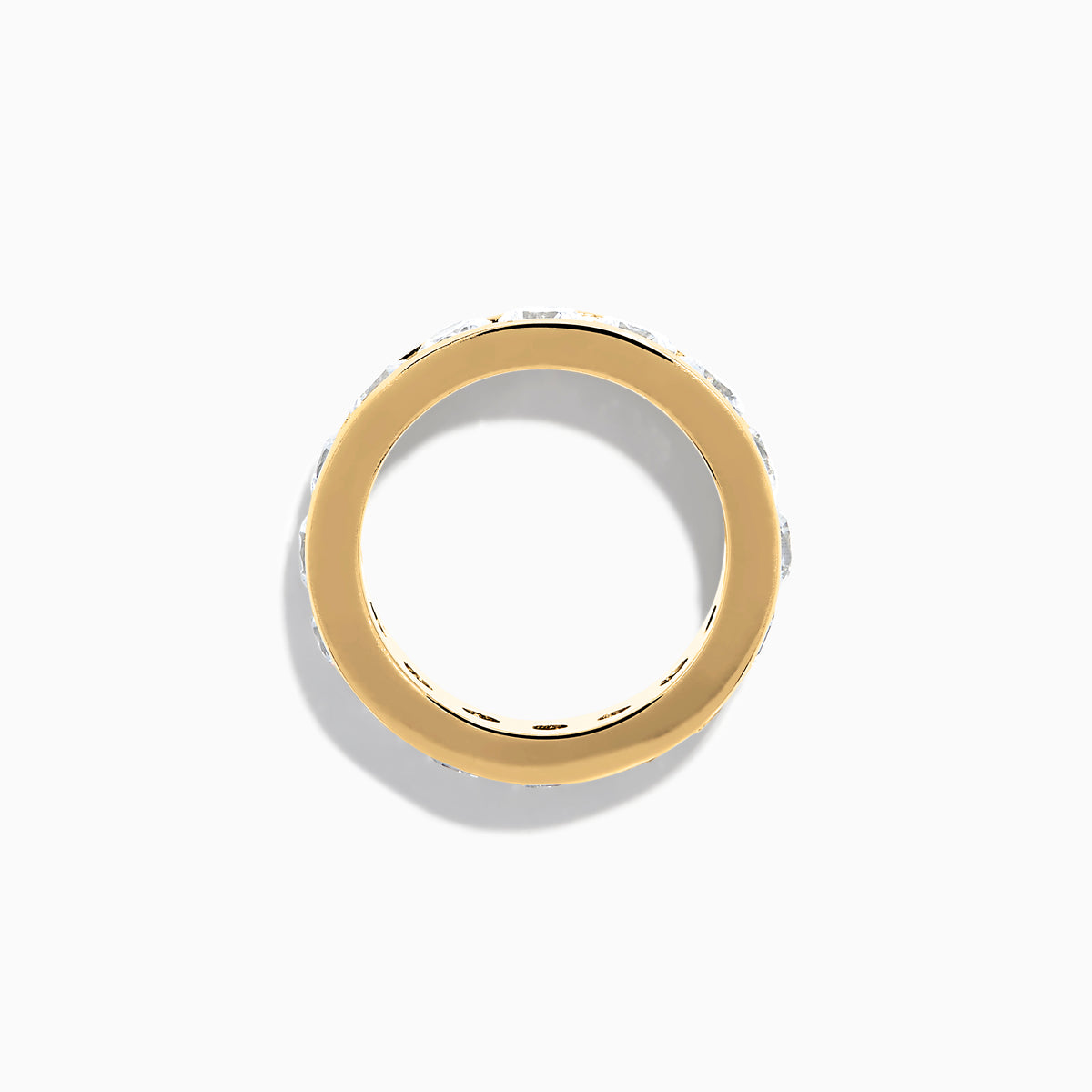 The 14K Yellow Gold Channel Set Diamond Eternity Band, 4.00 TCW, showcases large round diamonds in a continuous channel setting around the band, elegantly displayed on a white background.