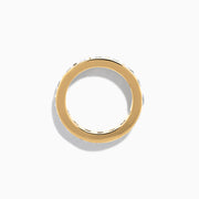 The 14K Yellow Gold Channel Set Diamond Eternity Band, 4.00 TCW, showcases large round diamonds in a continuous channel setting around the band, elegantly displayed on a white background.