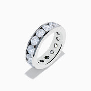 The 14K White Gold Channel Set Diamond Eternity Band features a continuous row of sparkling diamonds, 5.00 TCW, set in a sleek and polished band for a luxurious and elegant look.