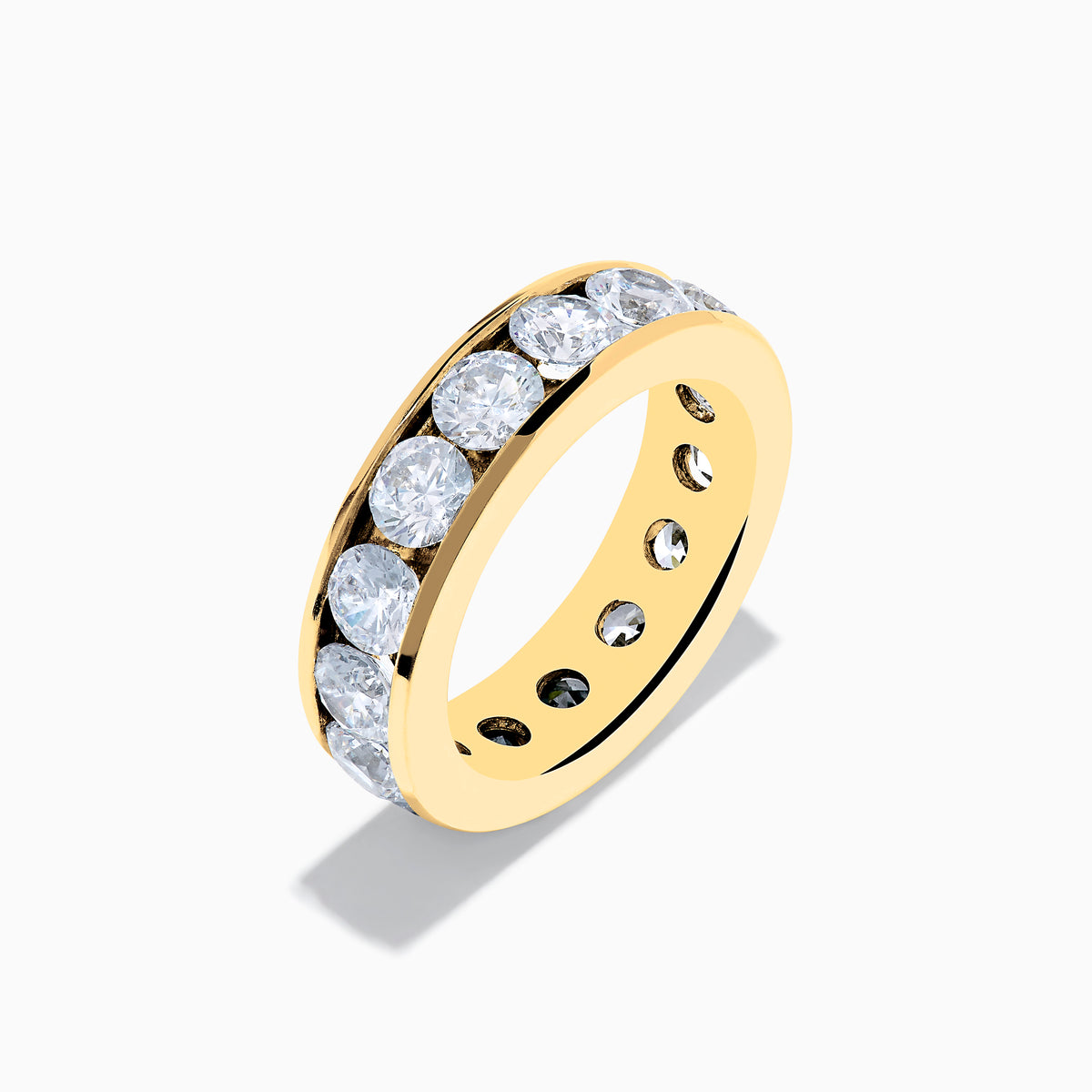 A 14K Yellow Gold Channel Set Diamond Eternity Band, 5.00 TCW, featuring round diamonds all around, displayed on a plain white background.