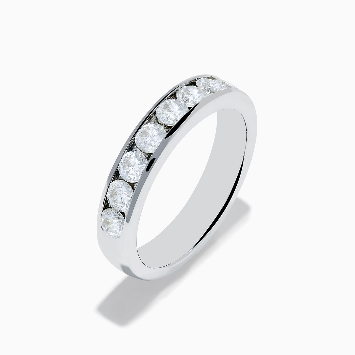 The 14K White Gold 10-Stone Channel Set Diamond Band, 1.00 TCW, features a row of sparkling round diamonds set along the top half and is displayed on a plain white background.