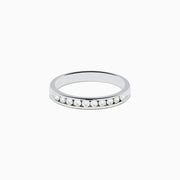 A 14K White Gold 10-Stone Channel Set Diamond Band, 0.25 TCW, featuring a row of sparkling round diamonds set along the band, shown on a plain white background.
