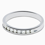 A 14K White Gold 10-Stone Channel Set Diamond Band, 0.25 TCW, featuring a row of sparkling round diamonds set along the band, shown on a plain white background.