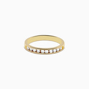 The 14K Yellow Gold 10-Stone Channel Set Diamond Band, 0.25 TCW, features a row of channel-set round diamonds along the band and is displayed on a white background.