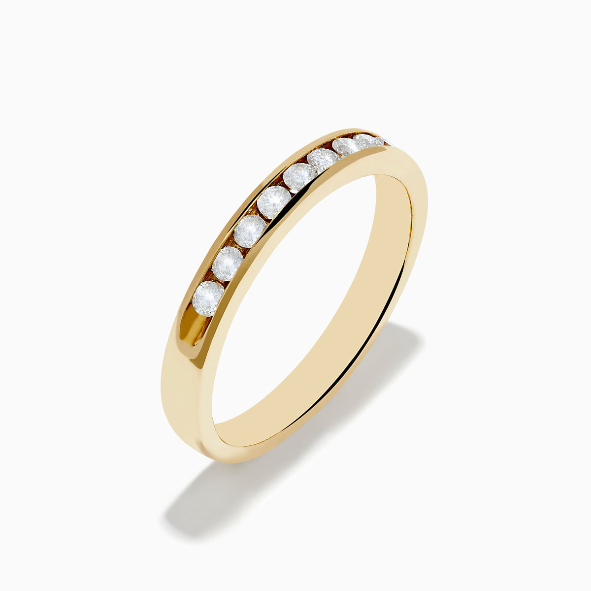 The 14K Yellow Gold 10-Stone Channel Set Diamond Band, 0.25 TCW, features a row of channel-set round diamonds along the band and is displayed on a white background.