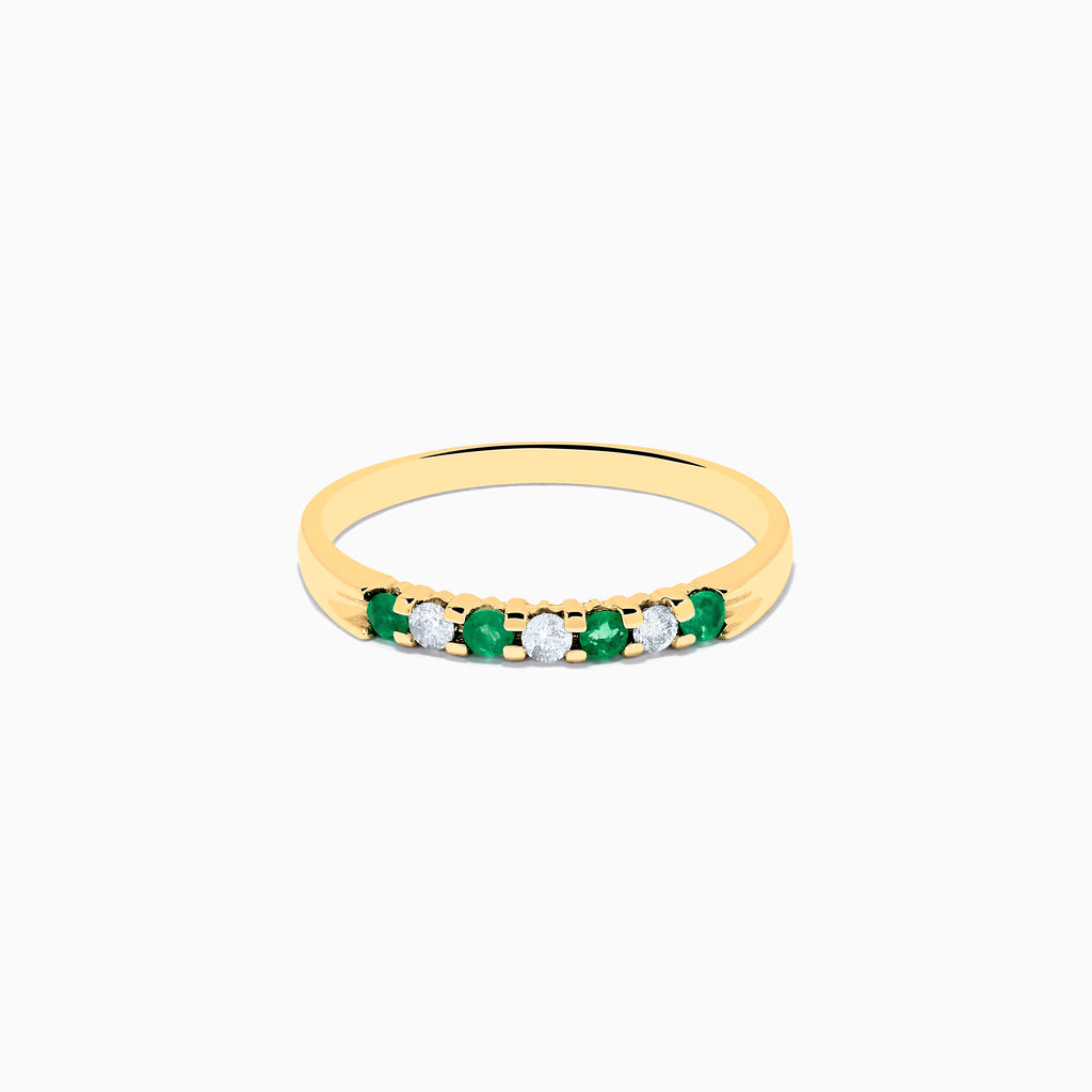 The 14K Yellow Gold 7-Stone Emerald & Diamond Band, 0.25 TCW, features alternating round white diamonds and emeralds set in a row on the band, shown against a white background.