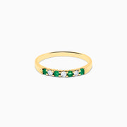 The 14K Yellow Gold 7-Stone Emerald & Diamond Band, 0.25 TCW, features alternating round white diamonds and emeralds set in a row on the band, shown against a white background.